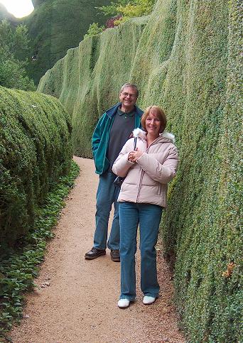 Karen and John Ridyard make their way through the clipped yew pathways.